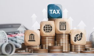tax block on top of currency
