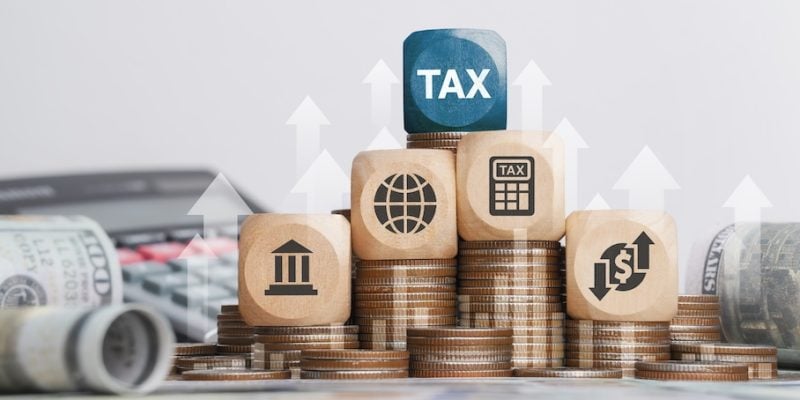 tax block on top of currency