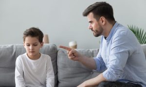 a man scolding his child