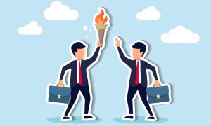 one person passing a torch to another