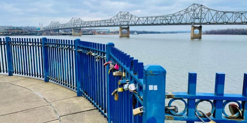 peoria lake bridge with locks adorning fencing