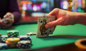 a person holding a poker hand