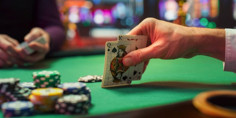 a person holding a poker hand