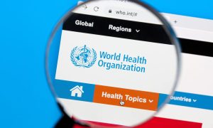 a magnifying glass over the world health organization website