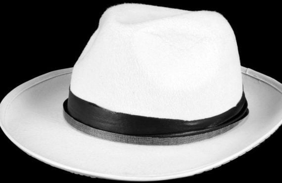 a white hat on a black canvas