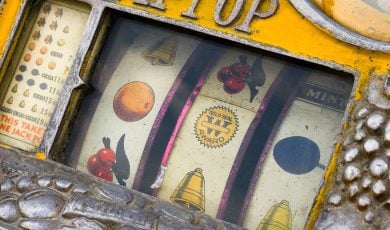 Mechanical reels of a vintage Rol-a-Top slot machine, showing corrosion