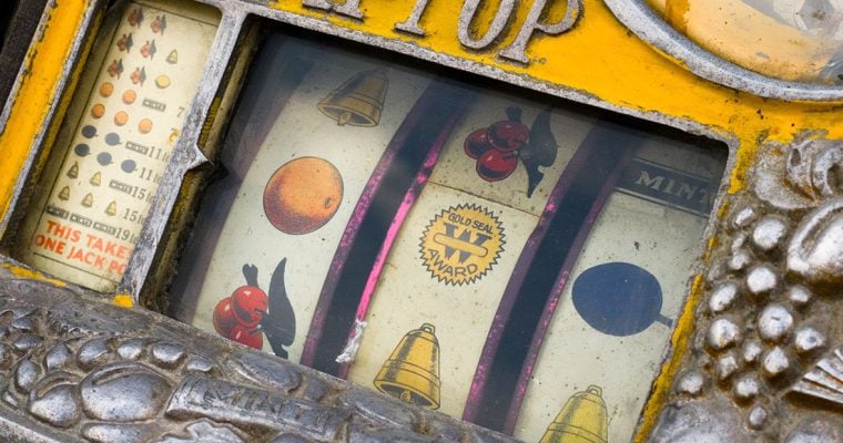 Mechanical reels of a vintage Rol-a-Top slot machine, showing corrosion