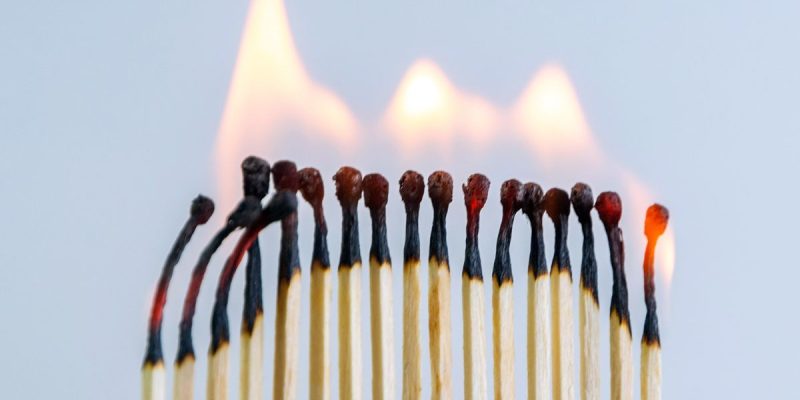 a series of lit matches side by side