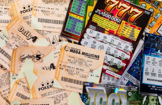 a pile of lottery draw and scratch tickets from michigan
