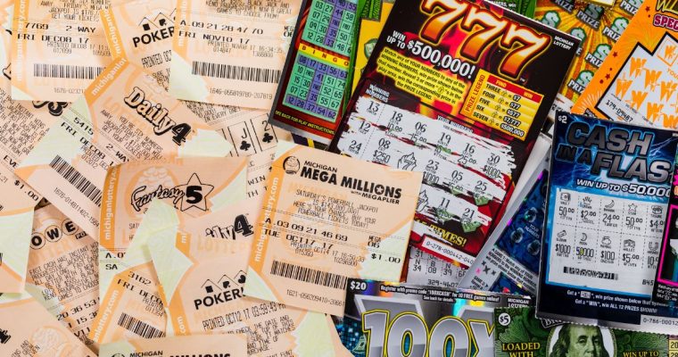 a pile of lottery draw and scratch tickets from michigan