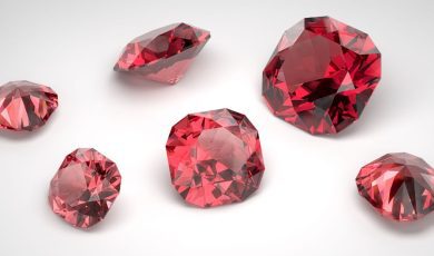 a collection of rubys on an off white background