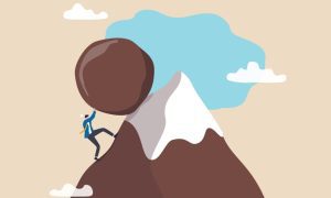 an illustration of a man pushing a boulder up a mountain