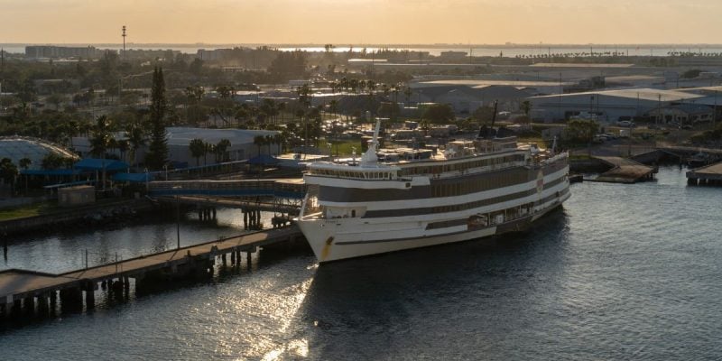 a cruise ship awaiting takeoff from a dock