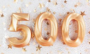 500 laid out in front of a bunch of golden stars