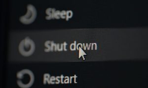 a computer screen highlighted over the shut down option while the sleep and restart options sandwhich it