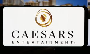 a photo of the caesars entertainment logo on a mobile phone
