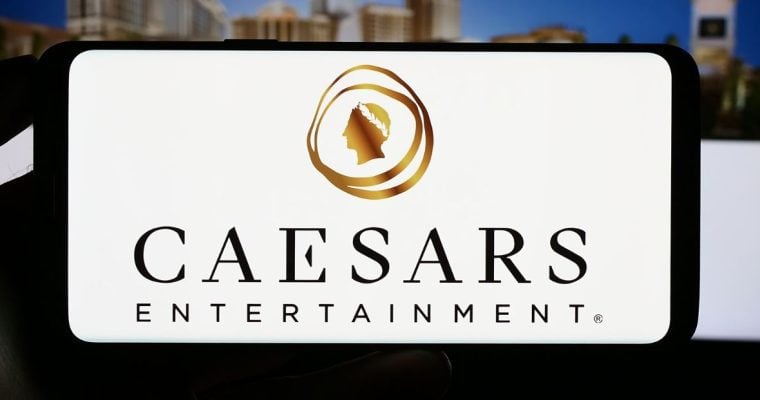 a photo of the caesars entertainment logo on a mobile phone