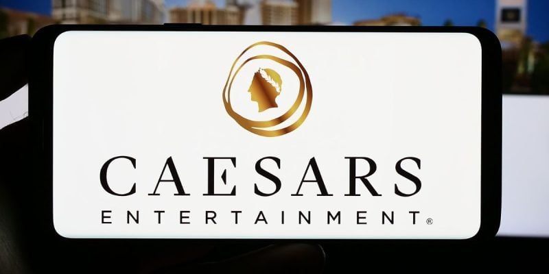a photo of the caesars entertainment logo on a mobile phone