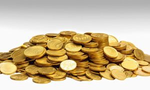 a collection of gold coins in a pile