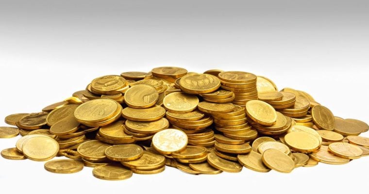 a collection of gold coins in a pile