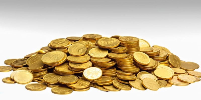 a collection of gold coins in a pile