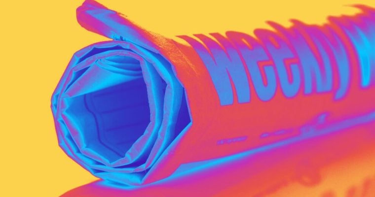 Rolled Up Weekly Newspaper in Neon Colored Filter