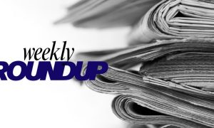 Stacked Newspapers With Weekly Roundup Text Overlay