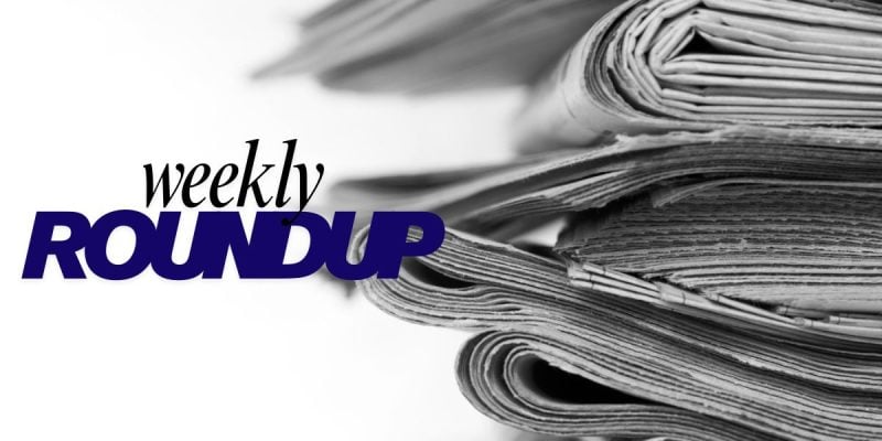 Stacked Newspapers With Weekly Roundup Text Overlay