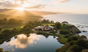Tribal Casino Sits On Bank of Beautiful Lake Surrounded By Trees and Sun Setting Background