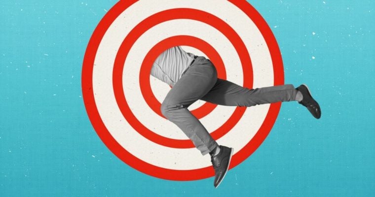 Man Jumps Through Red & White Target Graphic