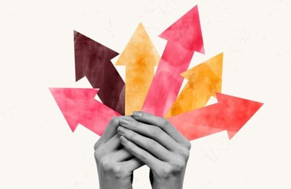 Collage Image of Hands Holding Variety of Colorful Arrows Pointing Upwards