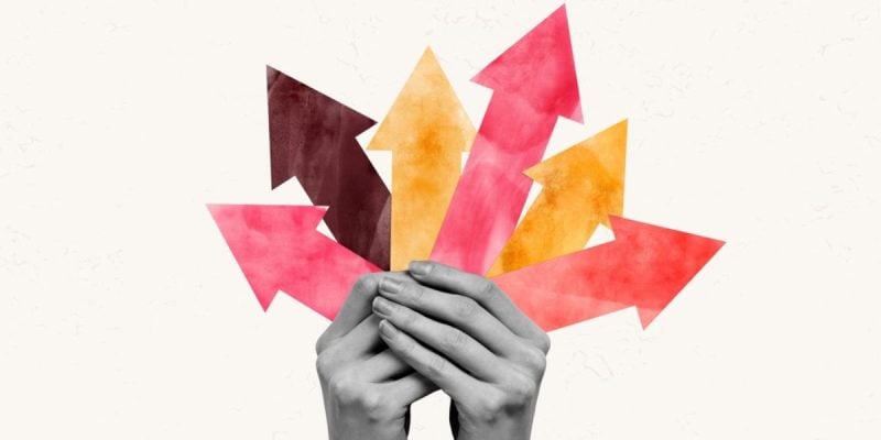 Collage Image of Hands Holding Variety of Colorful Arrows Pointing Upwards