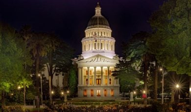 Well-Lit Entrance to the CA State Capital Building Surrounded By Trees