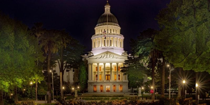 Well-Lit Entrance to the CA State Capital Building Surrounded By Trees