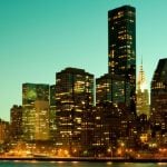 A Green Evening Sky Backdrops a Lit Up NYC Skyline