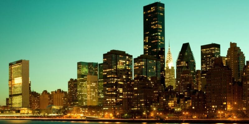 A Green Evening Sky Backdrops a Lit Up NYC Skyline