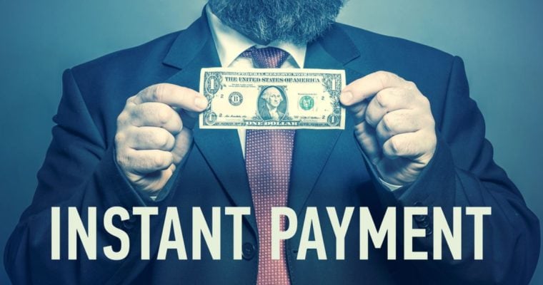 Man Holds Dollar In Cash with Phrase Instant Payment Below