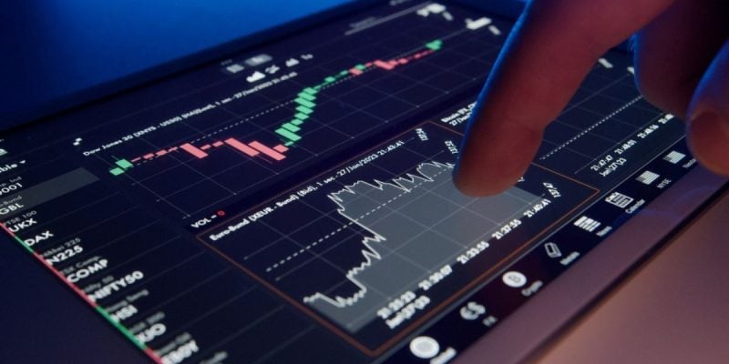 Digital Financial Graphs On Tablet With Finger