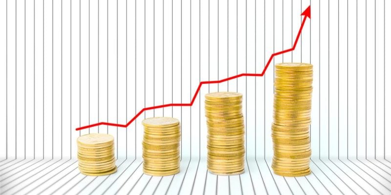 Piles of Gold Coins Increase from Left to Right With Red Arrow Above