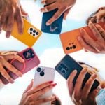 Colorful Cell Phones Face Downward Held in A Circle