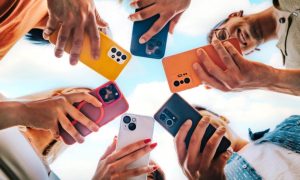 Colorful Cell Phones Face Downward Held in A Circle