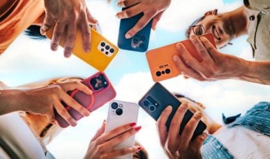 Colorful Cell Phones Face Downward Held in A Circle