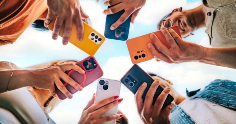 Colorful Cell Phones Face Downward Held in A Circle