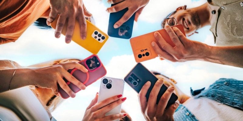 Colorful Cell Phones Face Downward Held in A Circle