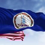 American Flag Behind Virginia Flag Waving in Blue Skies