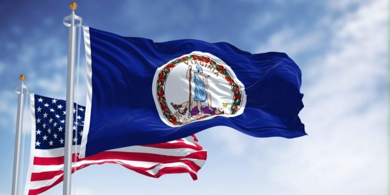 American Flag Behind Virginia Flag Waving in Blue Skies