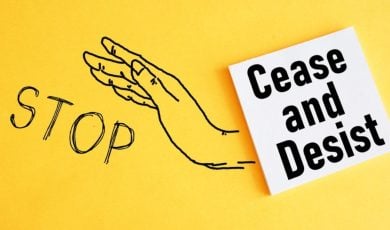 Sketched Hand and Word Stop with Caese and Desist