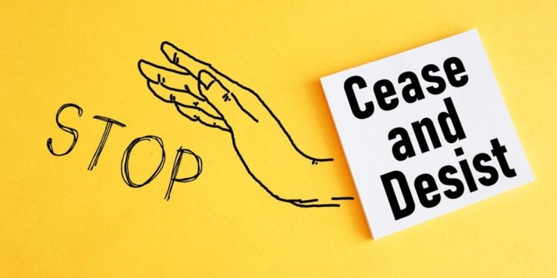 Sketched Hand and Word Stop with Caese and Desist