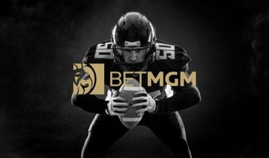 Black/White Photo of Crouching American Football Player with BetMGM Gold Logo