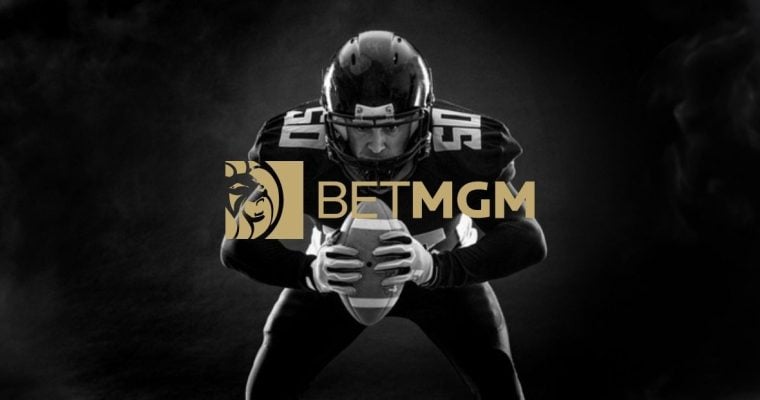 Black/White Photo of Crouching American Football Player with BetMGM Gold Logo
